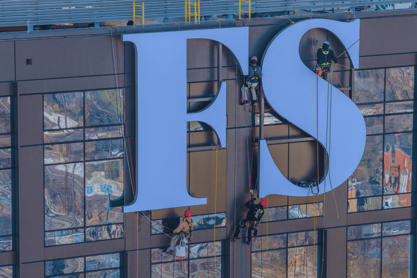 PSCO Sign Group high rise signage installation showcasing engineering, precision fabrication, and turnkey brand execution on a prominent building.