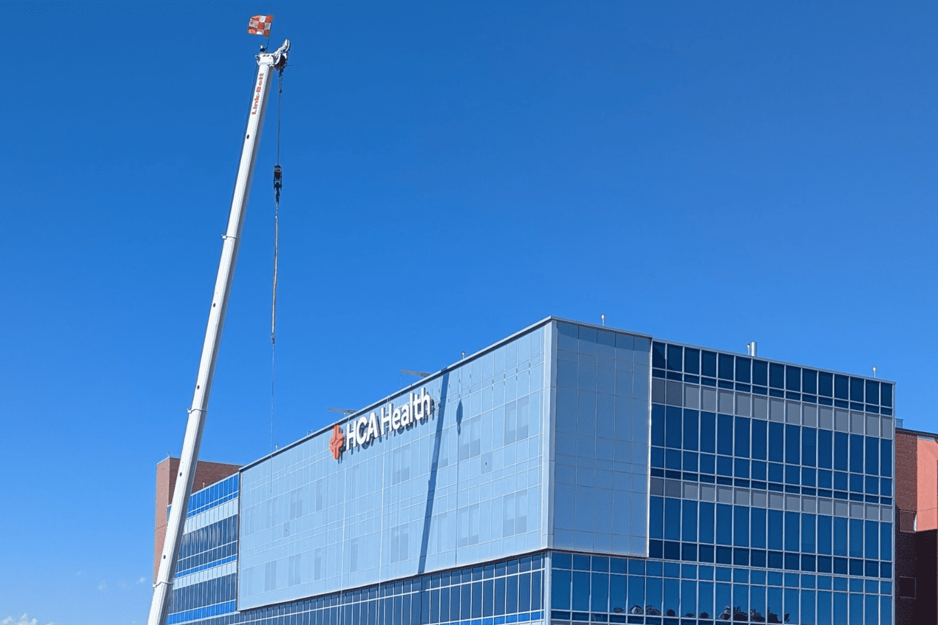 PSCO Sign Group high rise brand implementation featuring detailed engineering, fabrication, and installation for impactful skyline visibility.