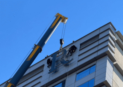 Custom high rise signage solution designed and installed by PSCO Sign Group to deliver strong brand visibility and reliable execution at elevation.