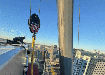 Large-scale high rise sign installation demonstrating PSCO Sign Group expertise in planning, coordination, safety, and architectural brand presence.